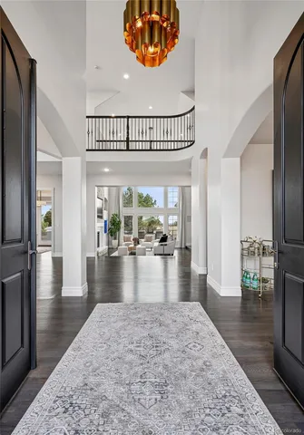 a view of entryway with wooden floor and stairs