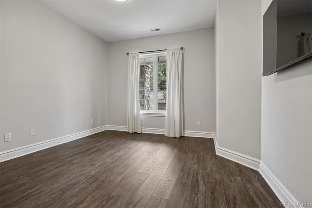 a spacious bathroom with a double vanity sink a mirror and a shower