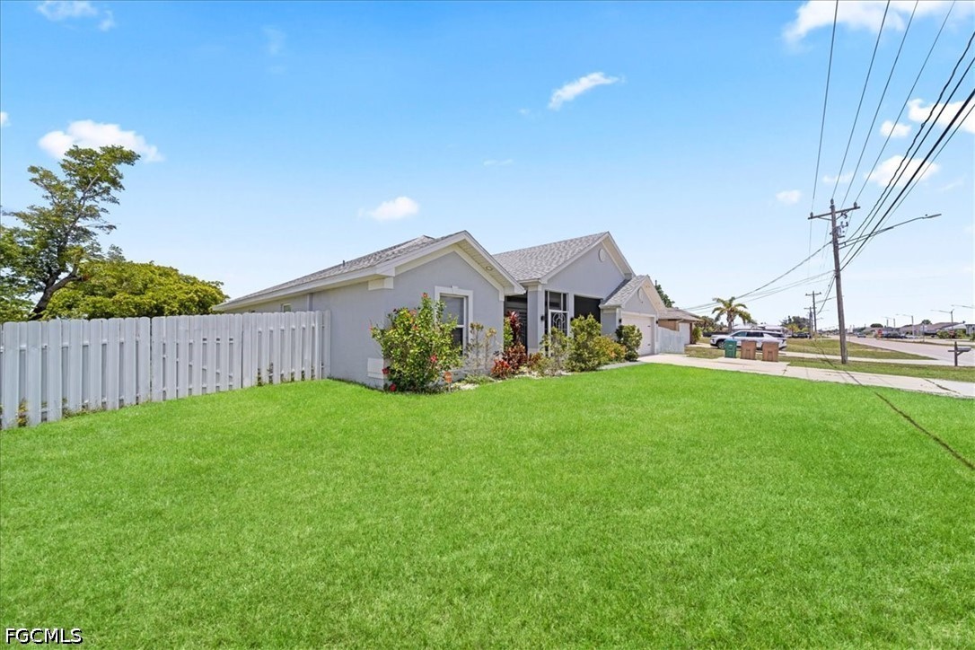22 Nelson Road South Cape Coral, FL 33991 - Photo 3 of 43 a view of an house with backyard space and garden