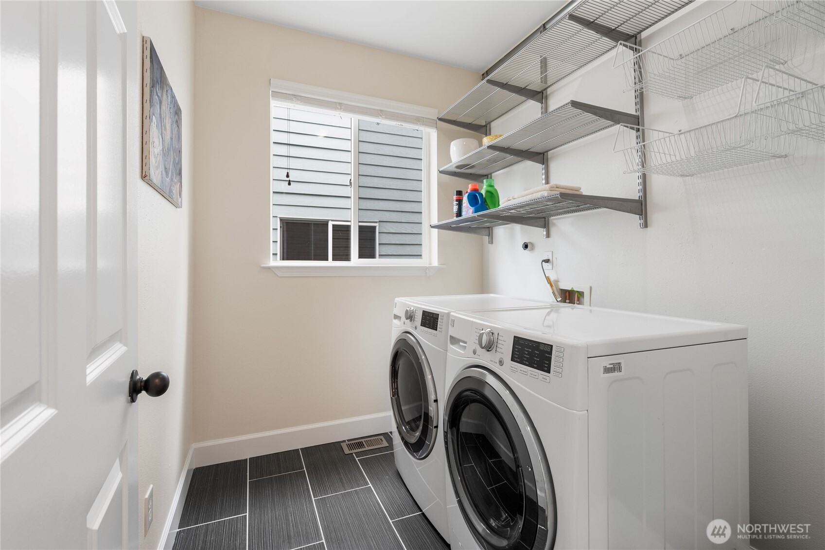 21104 1st Avenue West Bothell, WA 98021 - Photo 17 of 34 a view of storage and utility room with washer and dryer
