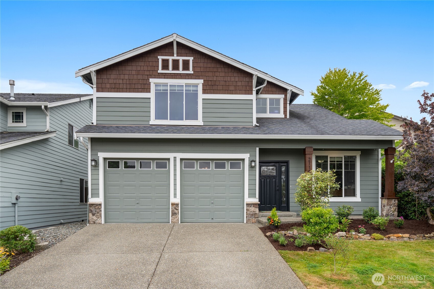 21104 1st Avenue West Bothell, WA 98021 - Photo 2 of 34 a front view of a house with garden