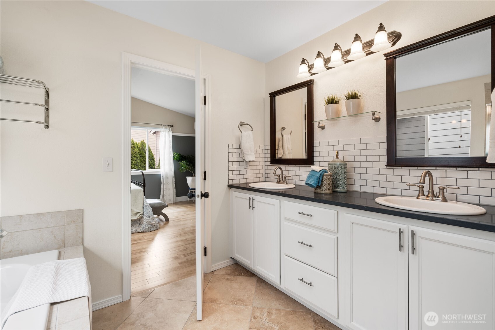 21104 1st Avenue West Bothell, WA 98021 - Photo 22 of 34 a spacious bathroom with double sink and a mirror