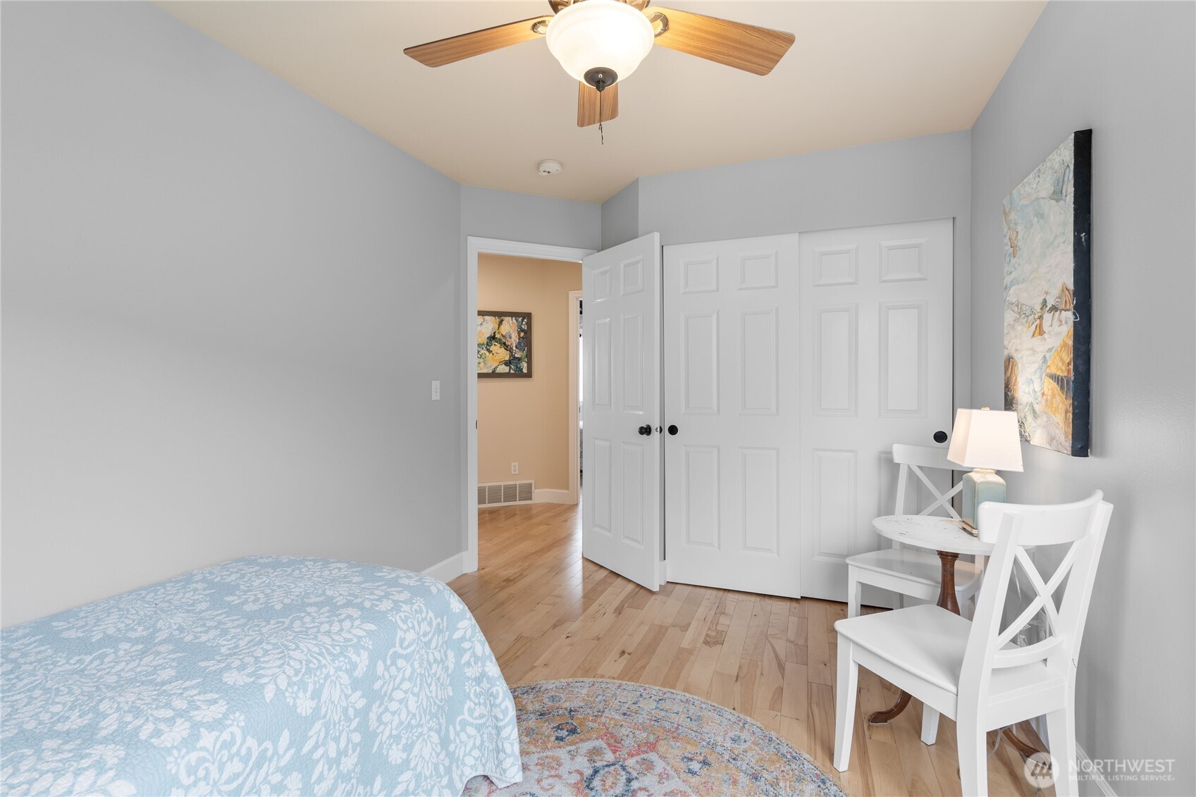 21104 1st Avenue West Bothell, WA 98021 - Photo 27 of 34 a bedroom with a bed and a chandelier