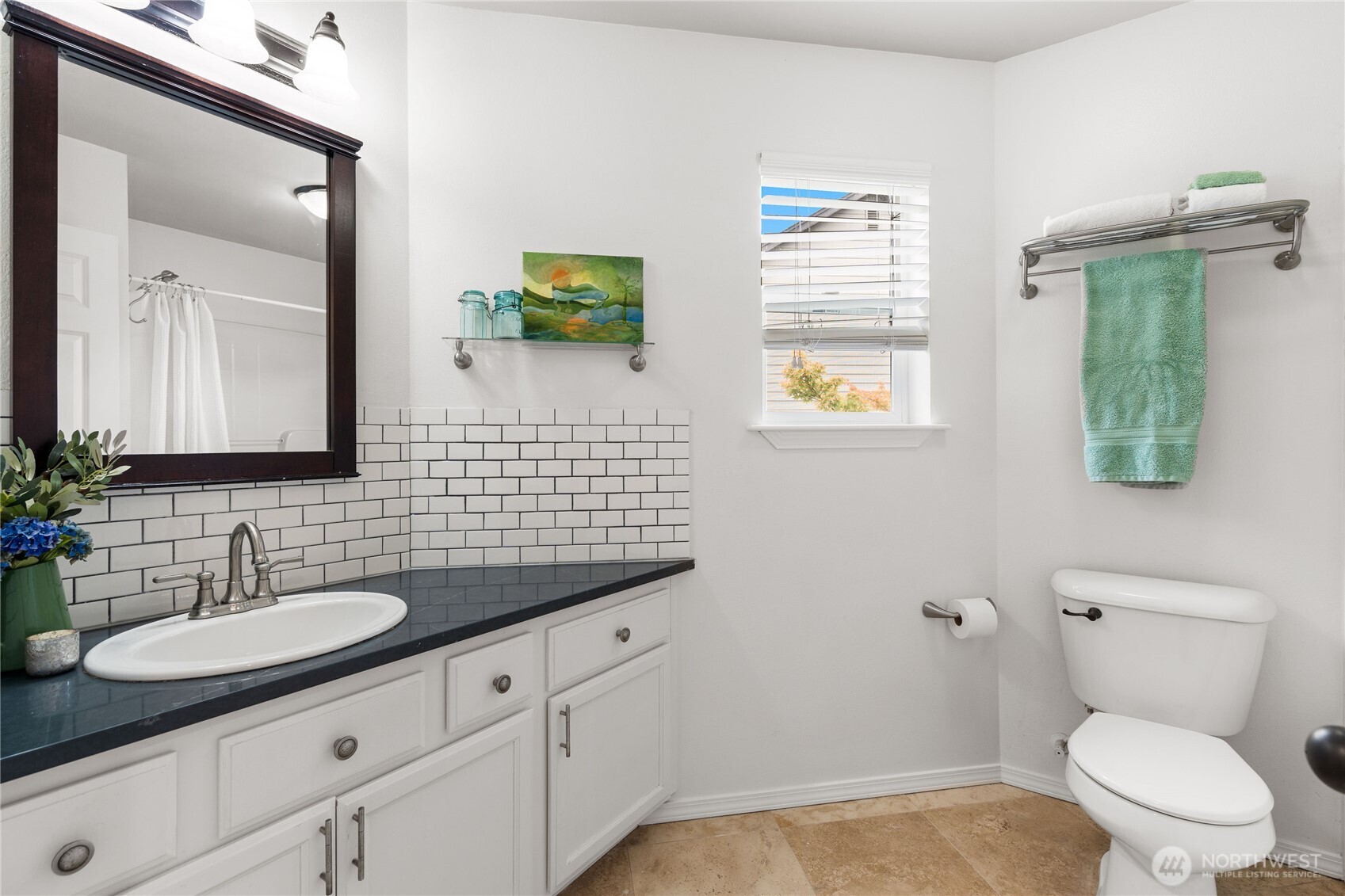 21104 1st Avenue West Bothell, WA 98021 - Photo 29 of 34 a bathroom with a toilet a sink and mirror