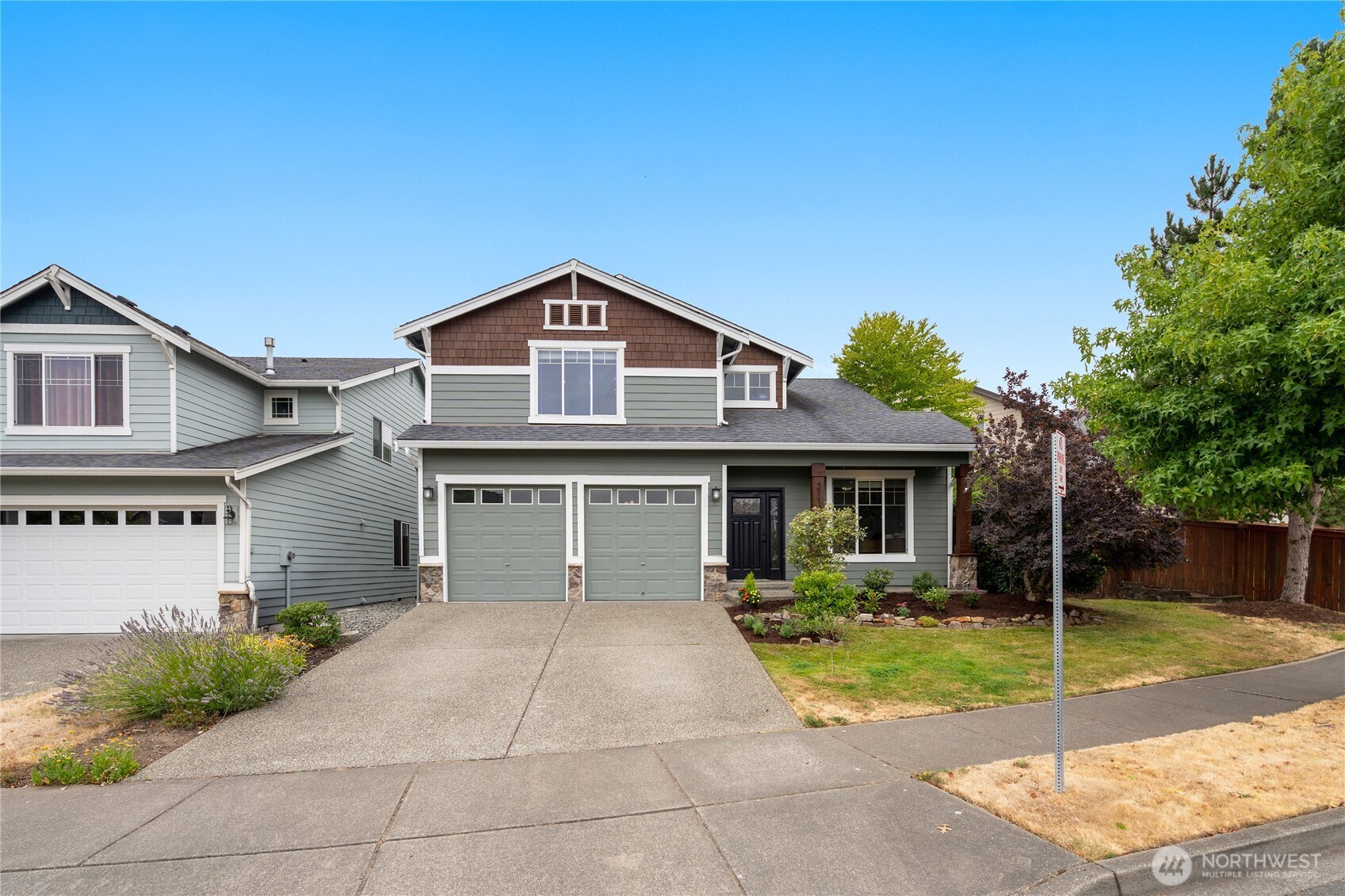 21104 1st Avenue West Bothell, WA 98021 - Photo 3 of 34 a front view of a house with garden