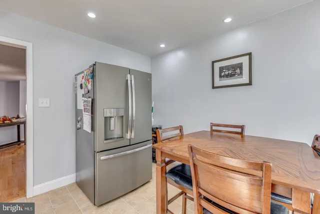 a kitchen with stainless steel appliances a refrigerator and a stove