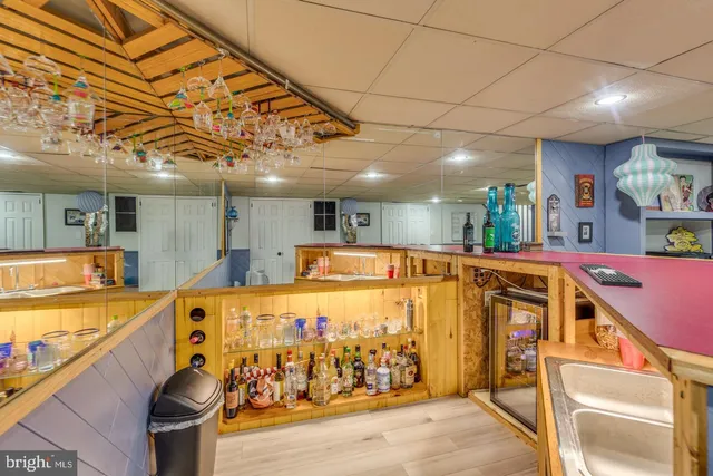 a view of a kitchen with stainless steel appliances granite countertop a sink and cabinets