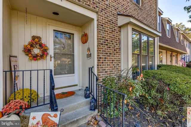 a outdoor view of a house with outdoor seating