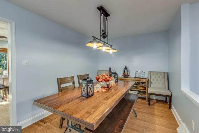 a dining room with a table and chairs