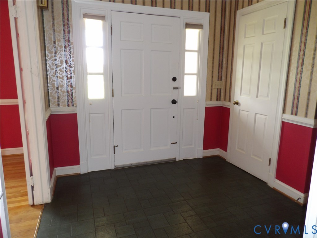 3813 Johnson Road Petersburg, VA 23805 - Photo 26 of 51 Entryway with a paneled front door, sidelight wind