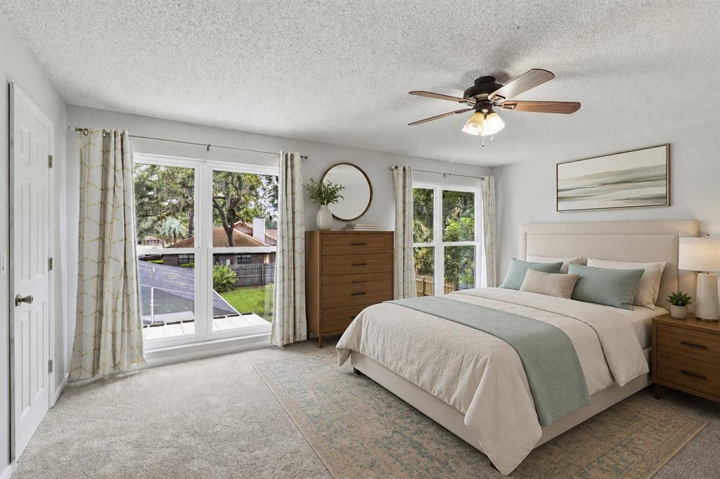 302 Bloomingfield Drive Brandon, FL 33511 - Photo 26 of 58 a bedroom with a bed and a large window