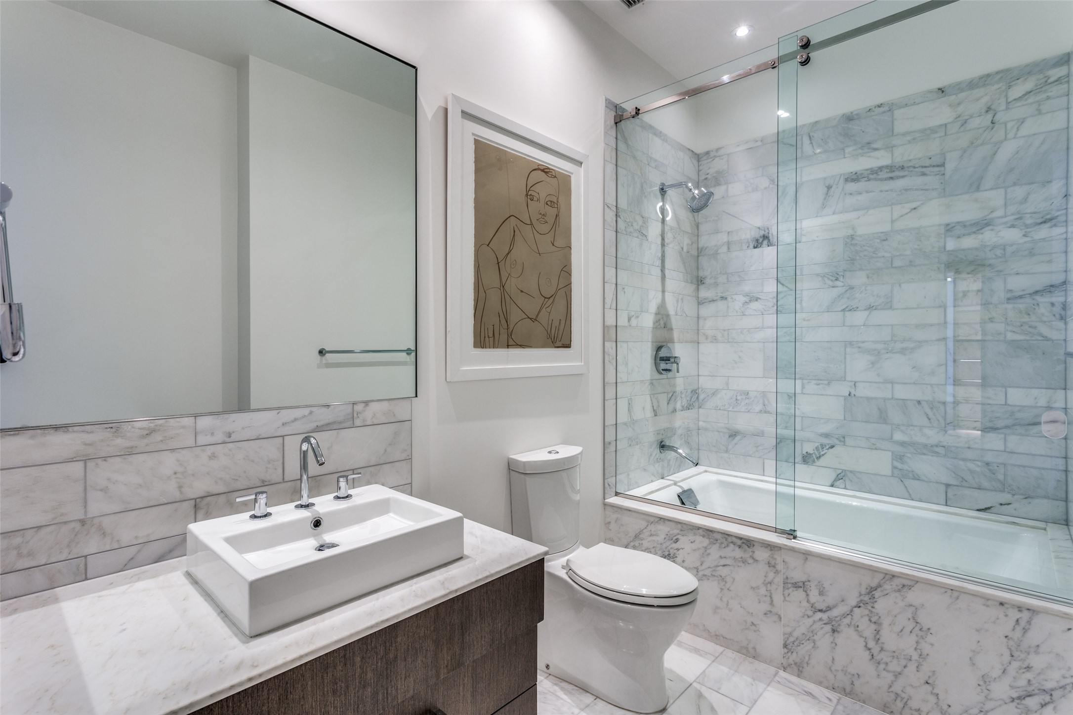 210 Lavaca Street, Unit 3305 Austin, TX 78701 - Photo 21 of 24 Bathroom featuring vanity and shower / bath combination with glass door