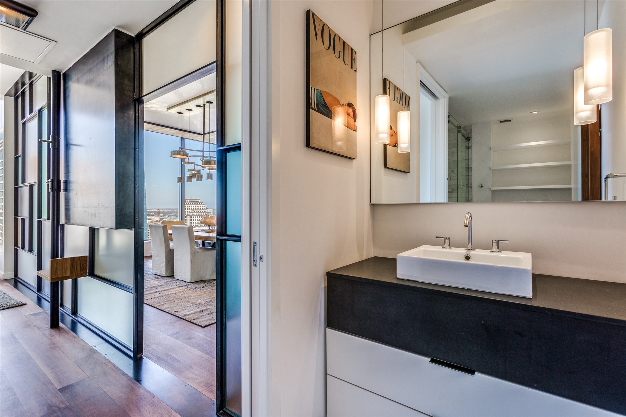 210 Lavaca Street, Unit 3305 Austin, TX 78701 - Photo 6 of 24 Bathroom featuring vanity, a stall shower, dark wood-style floors, and floor to ceiling windows