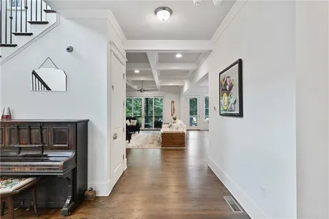 a living room with furniture fireplace and window