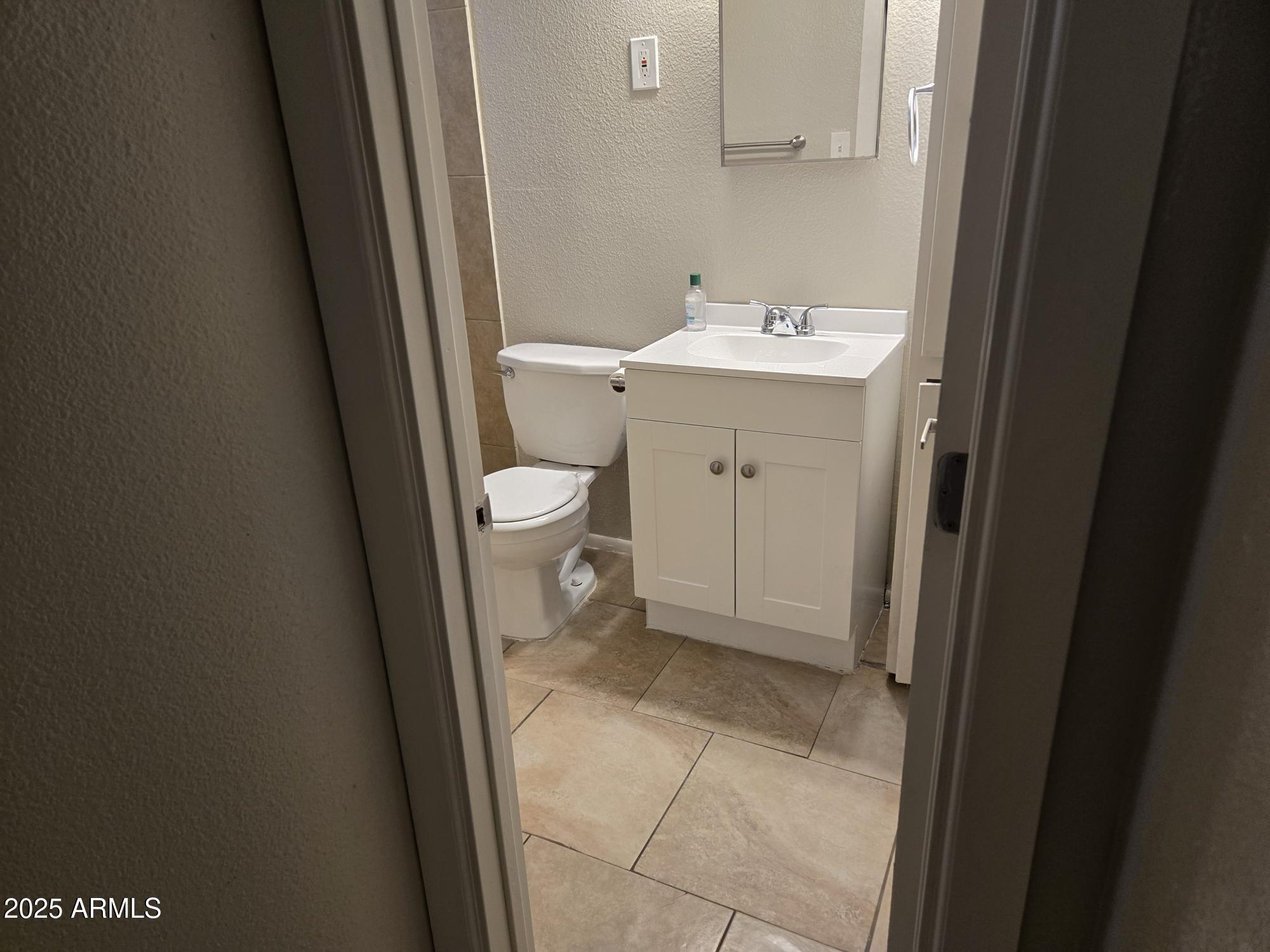 902 East Southern Avenue, Unit 2 Phoenix, AZ 85040 - Photo 21 of 25 a bathroom with a sink and a toilet