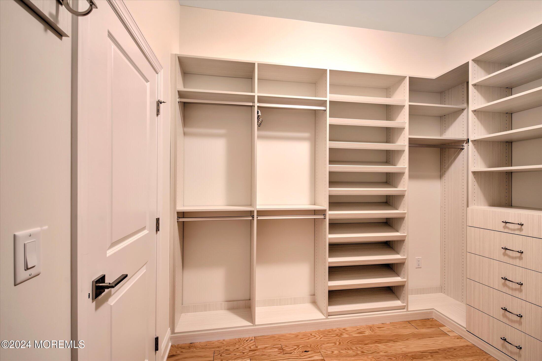 166 Grandview Circle Howell, NJ 07731 - Photo 15 of 48 a view of walk in closet with empty racks
