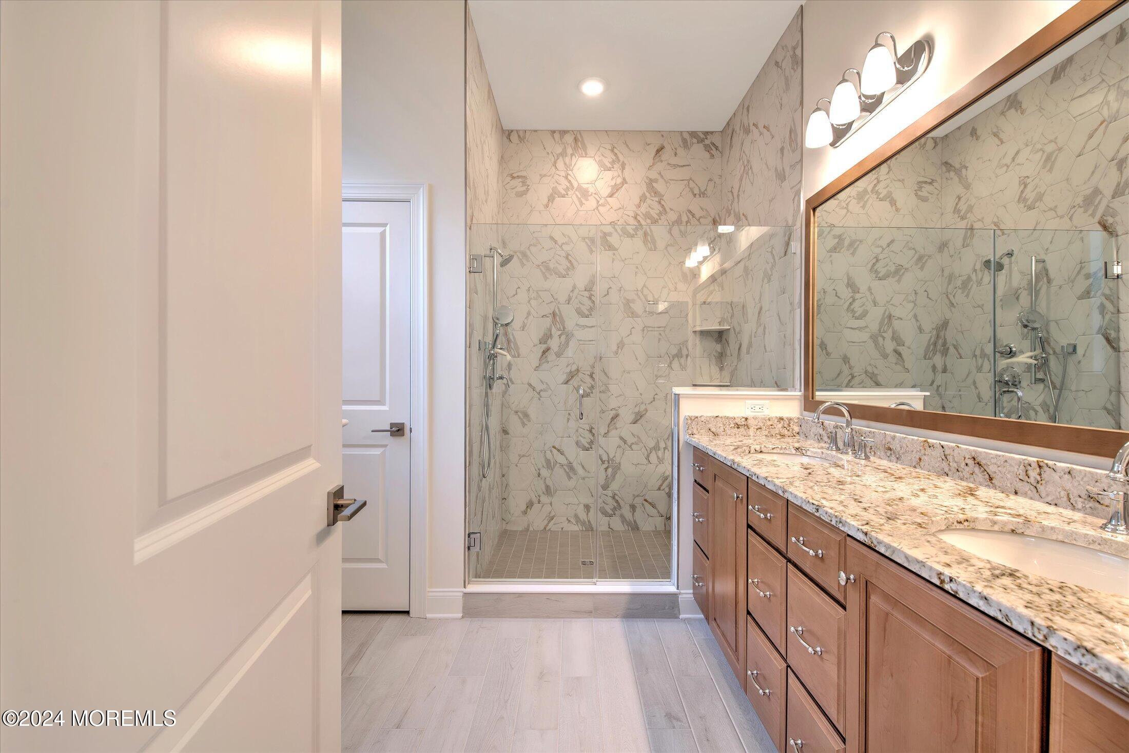 166 Grandview Circle Howell, NJ 07731 - Photo 17 of 48 a bathroom with a granite countertop sink a mirror and shower
