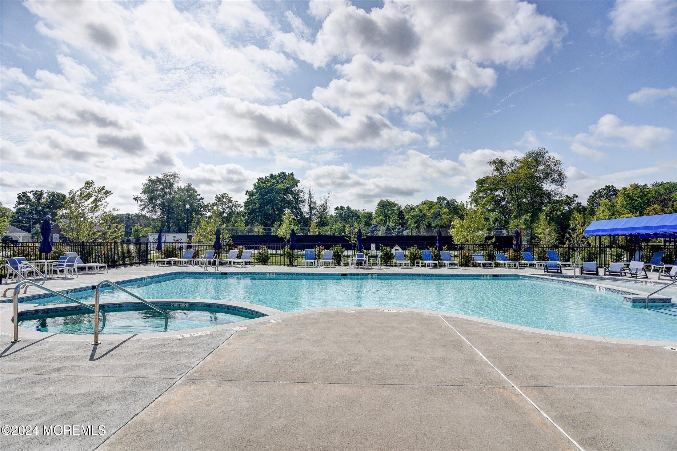 166 Grandview Circle Howell, NJ 07731 - Photo 31 of 48 a view of swimming pool with outdoor seating and plants