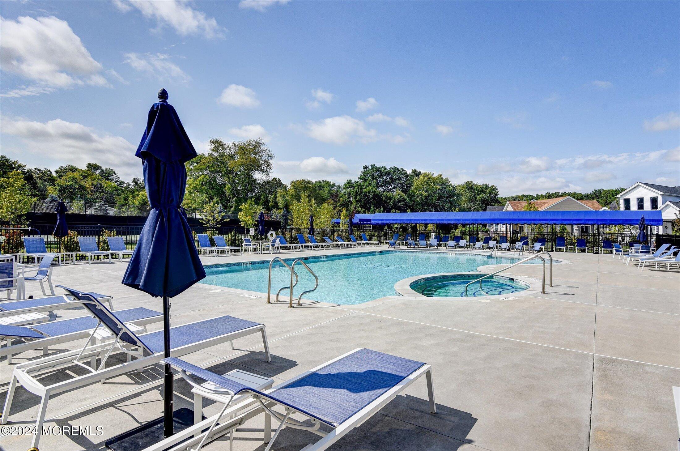 166 Grandview Circle Howell, NJ 07731 - Photo 32 of 48 a view of a swimming pool with a patio