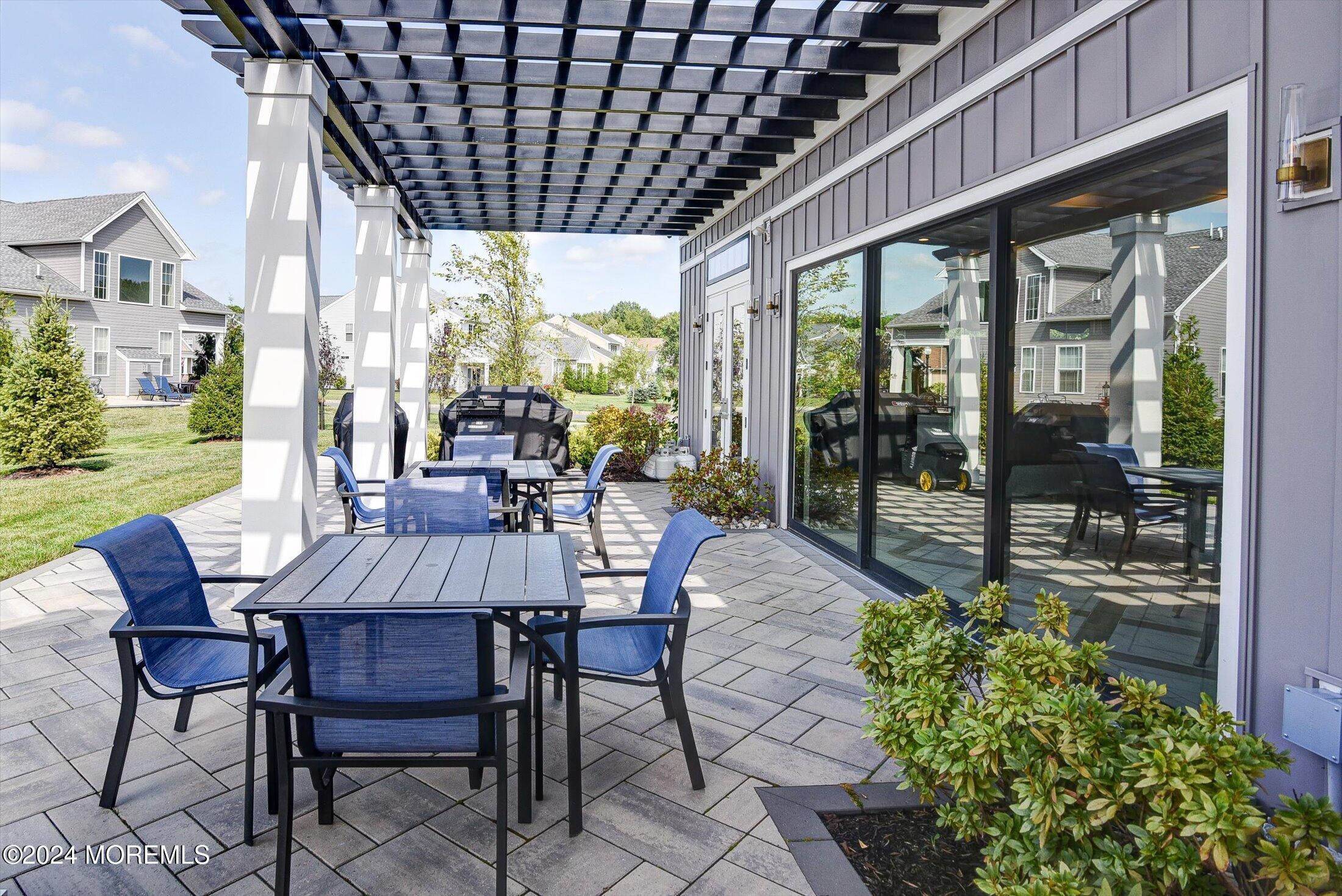166 Grandview Circle Howell, NJ 07731 - Photo 44 of 48 a view of a patio with table and chairs and potted plants