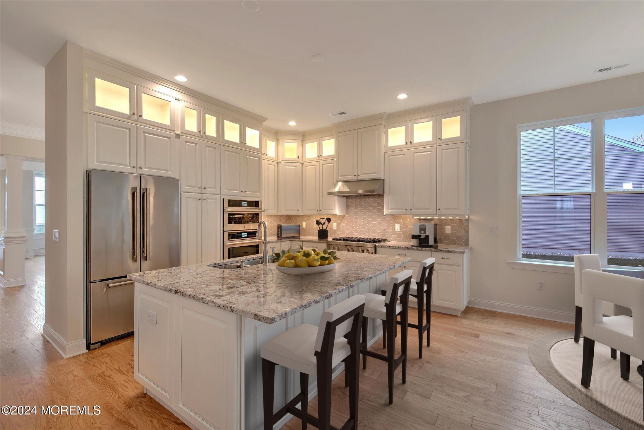 166 Grandview Circle Howell, NJ 07731 - Photo 7 of 48 a kitchen with stainless steel appliances granite countertop a kitchen island a stove a table and chairs