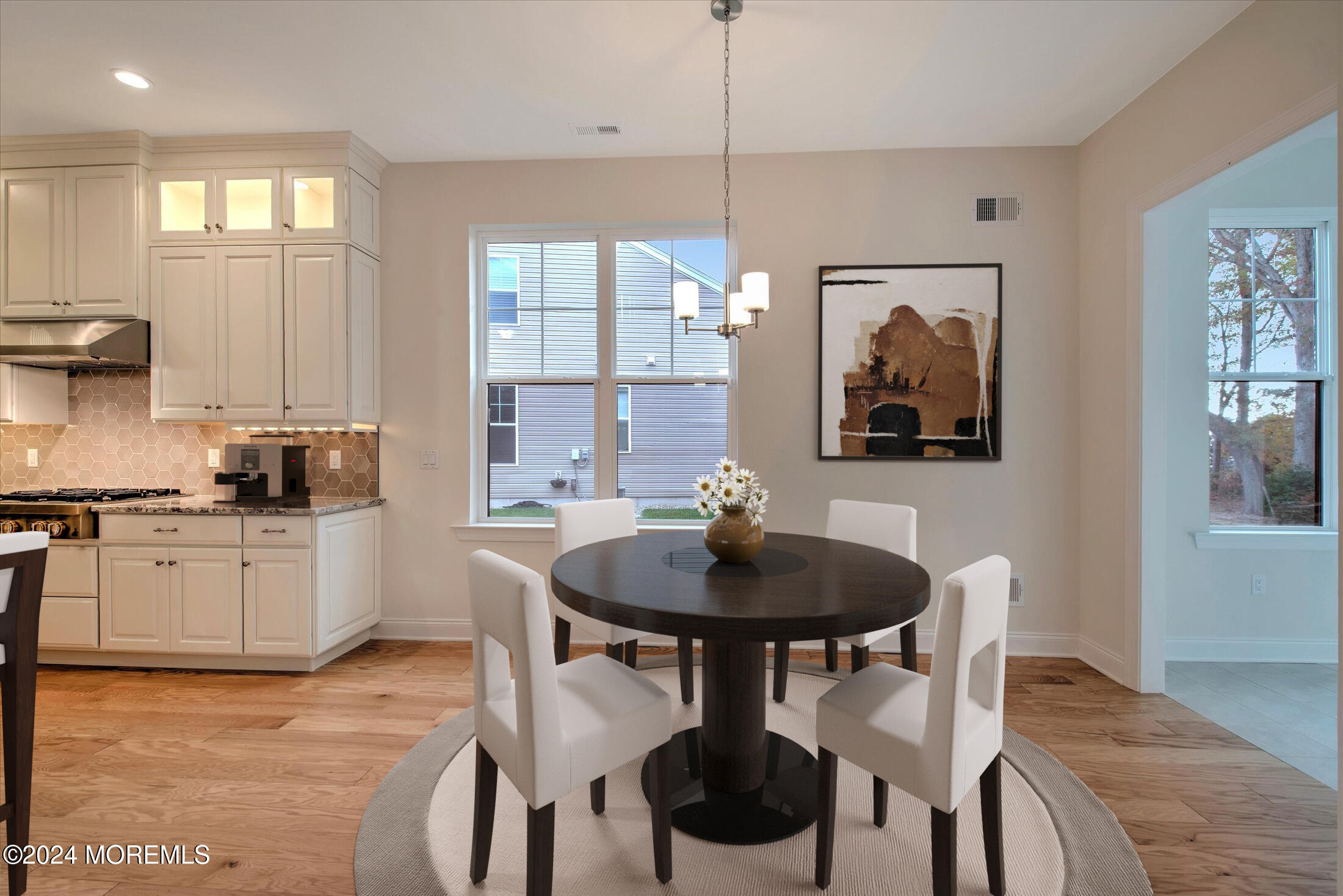 166 Grandview Circle Howell, NJ 07731 - Photo 8 of 48 a kitchen with stainless steel appliances kitchen island a table and chairs in it