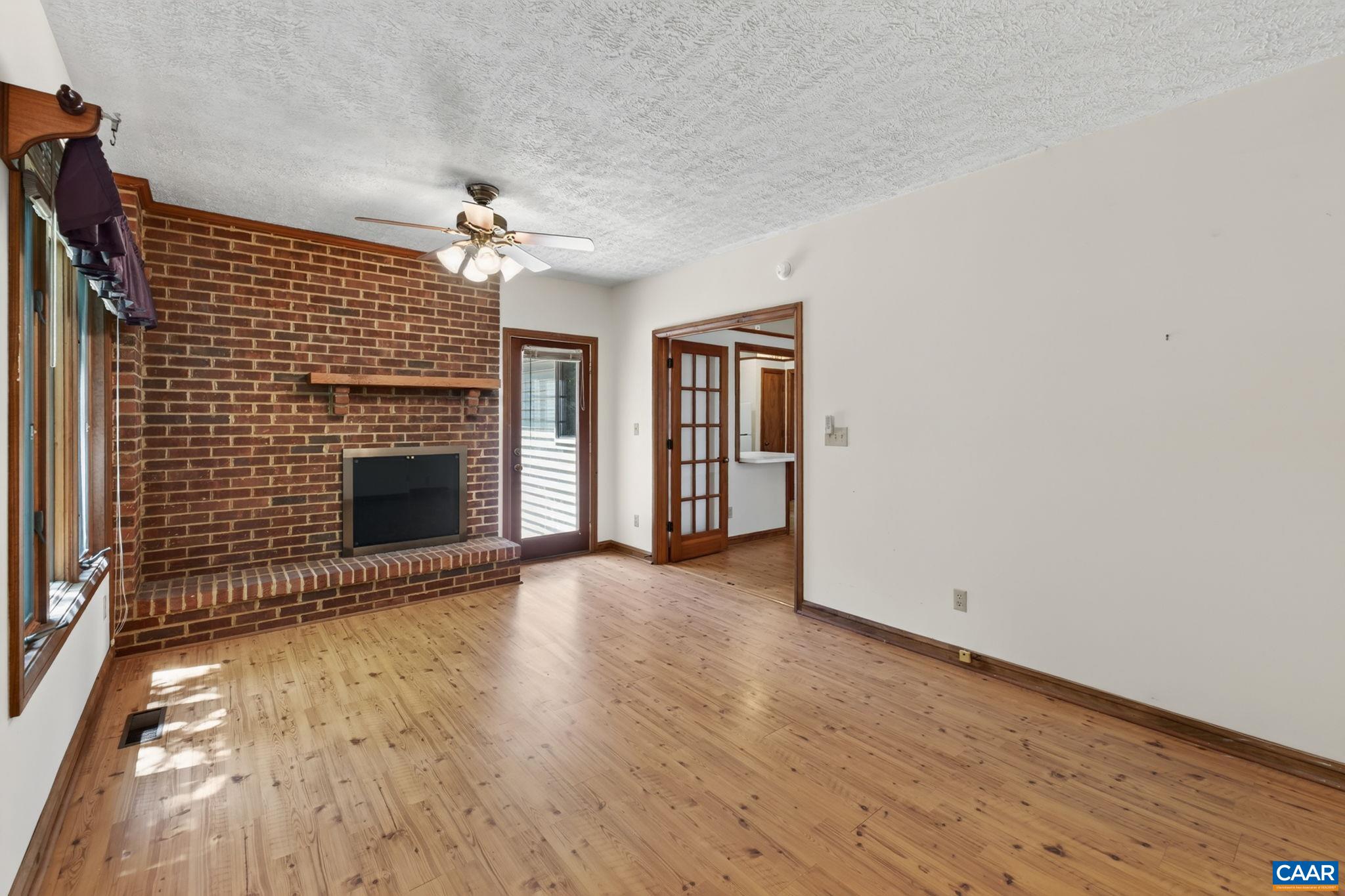 9 Timberlake Terrace Palmyra, VA 22963 - Photo 14 of 35 a view of a livingroom with wooden floor and a fireplace