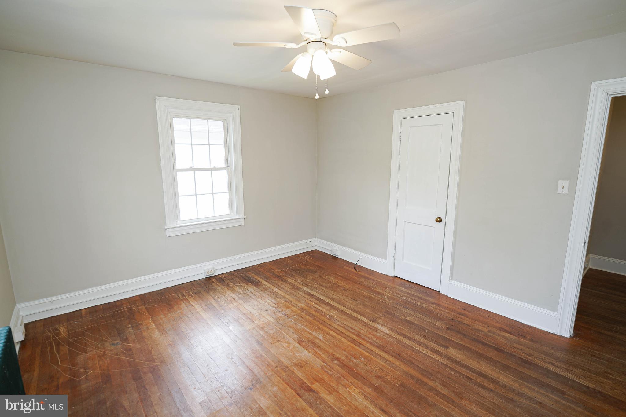 234 North Boulevard, Unit A Salisbury, MD 21801 - Photo 28 of 38 wooden floor in an empty room with a window