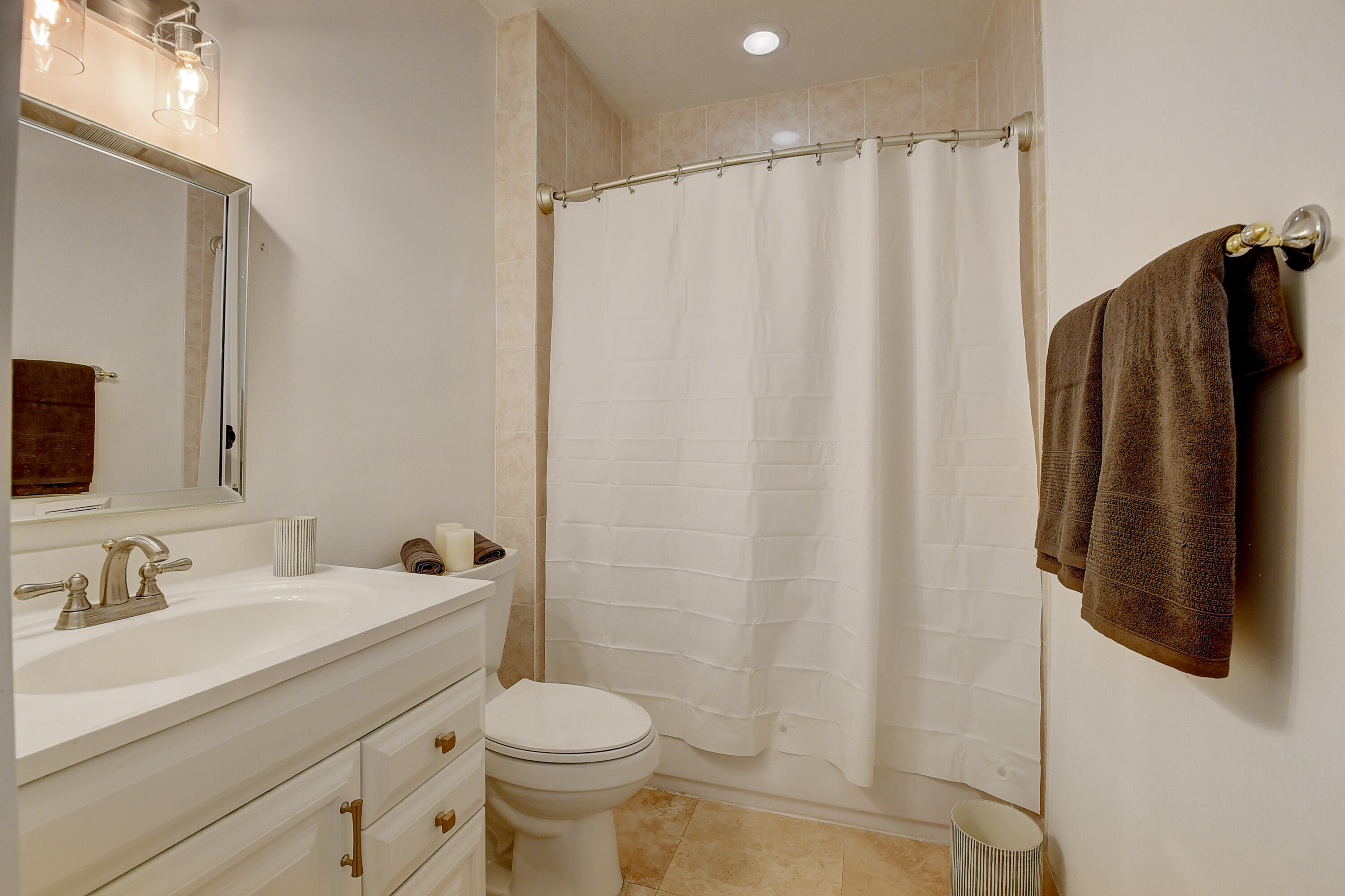 9058 Southwest 4th Street Boca Raton, FL 33433 - Photo 16 of 53 a bathroom with a sink a toilet and shower