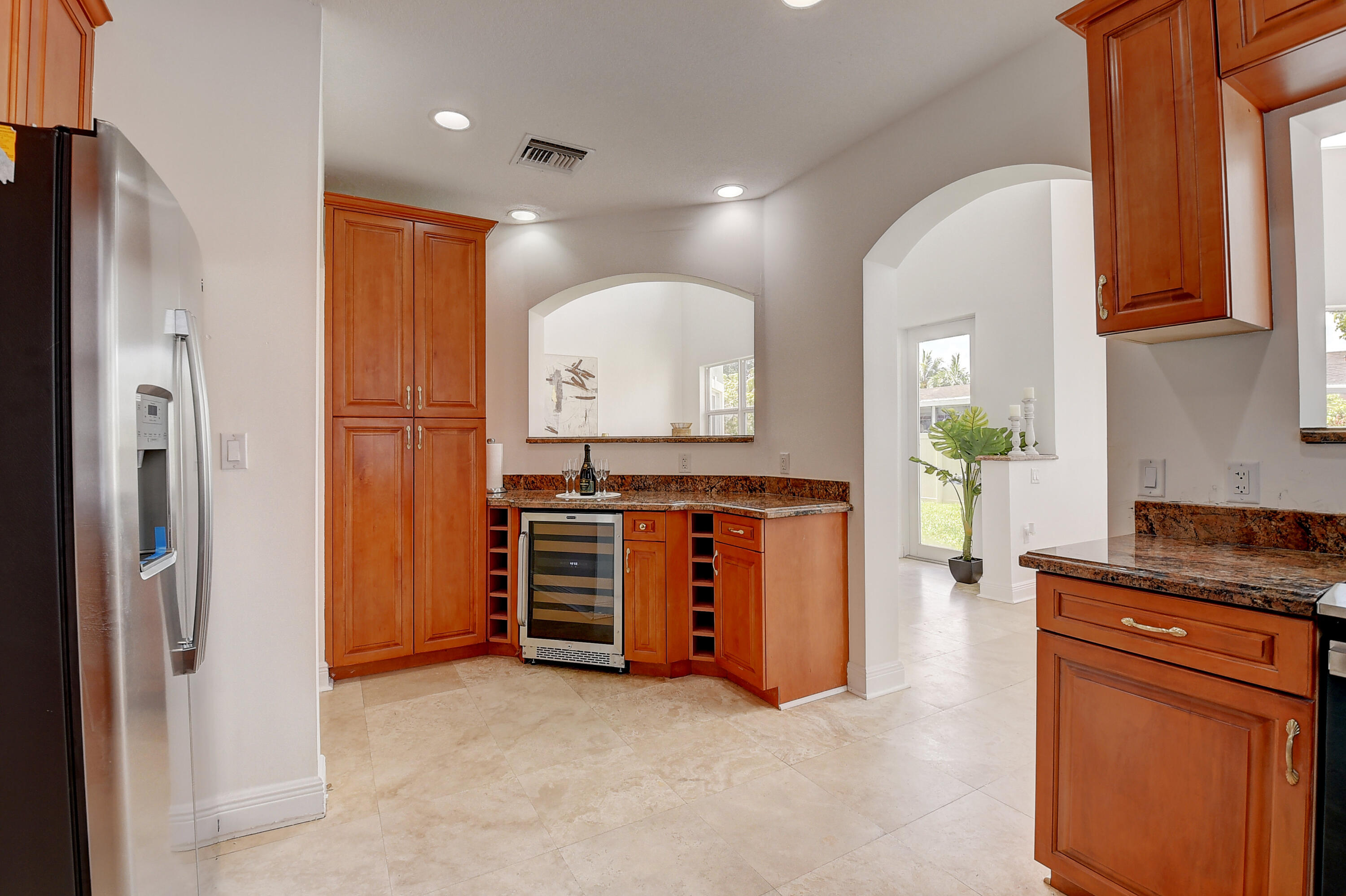 9058 Southwest 4th Street Boca Raton, FL 33433 - Photo 19 of 53 a view of kitchen with stainless steel appliances granite countertop cabinets and a dresser