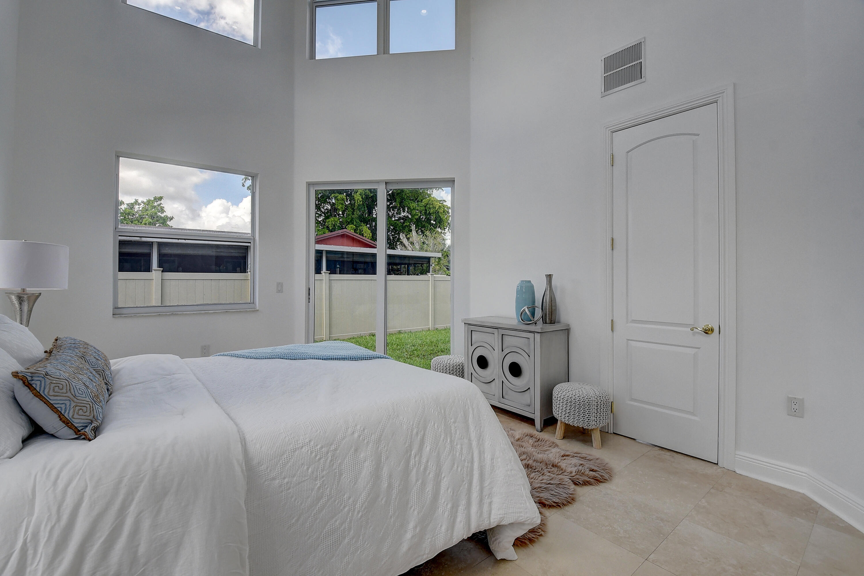 9058 Southwest 4th Street Boca Raton, FL 33433 - Photo 21 of 53 a bedroom with a bed and a window