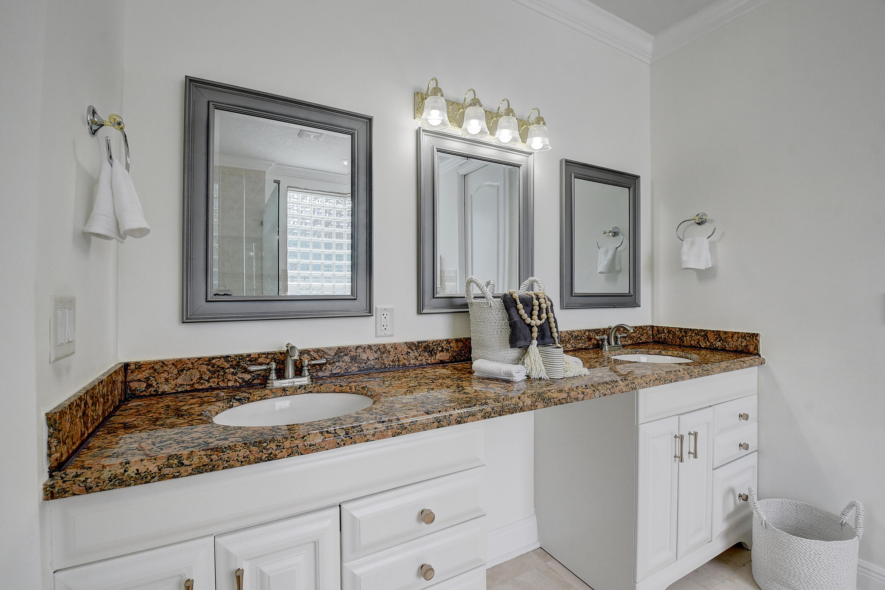 9058 Southwest 4th Street Boca Raton, FL 33433 - Photo 23 of 53 a bathroom with a granite countertop sink and a mirror