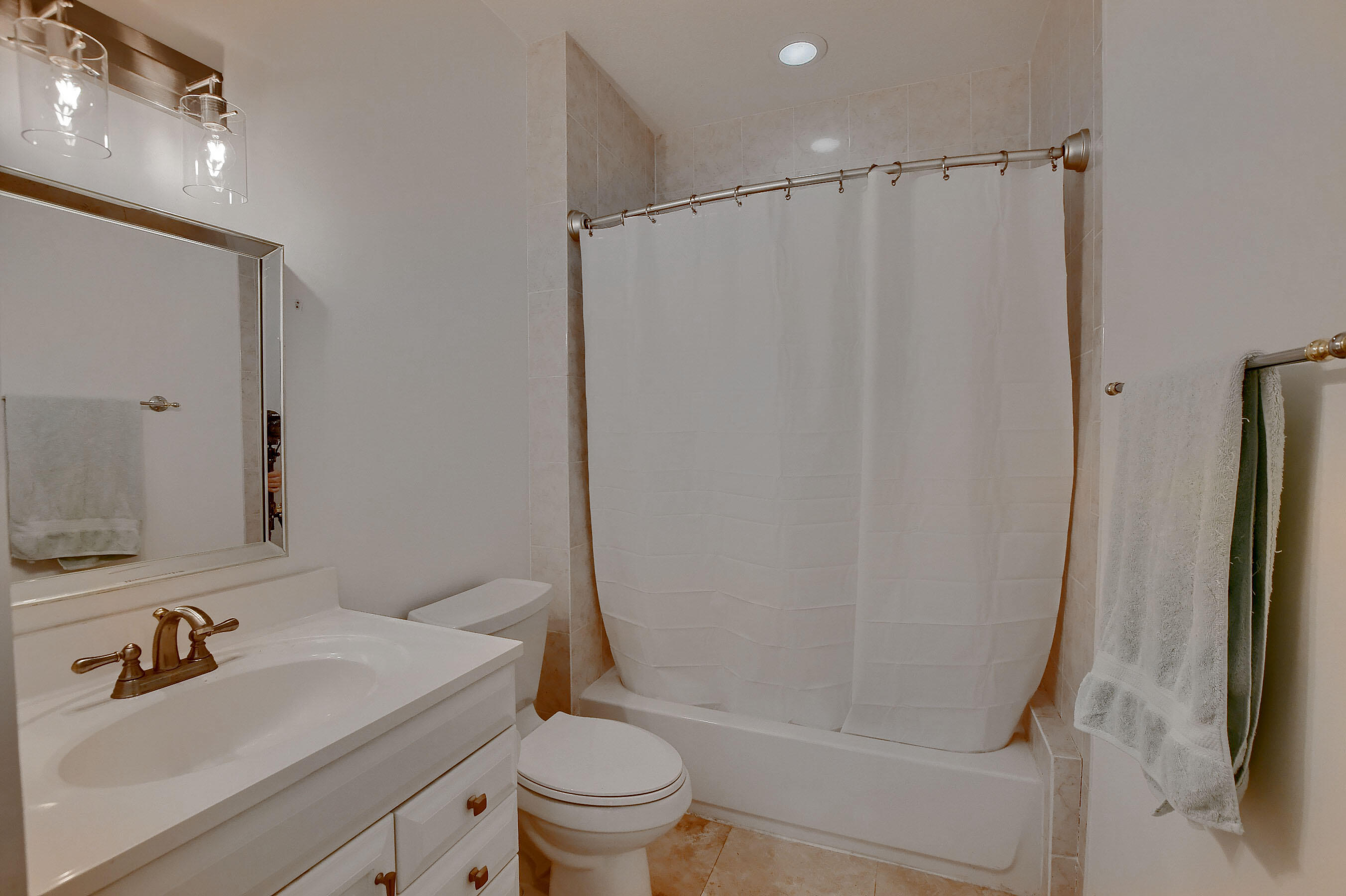 9058 Southwest 4th Street Boca Raton, FL 33433 - Photo 28 of 53 a bathroom with a sink a toilet and shower