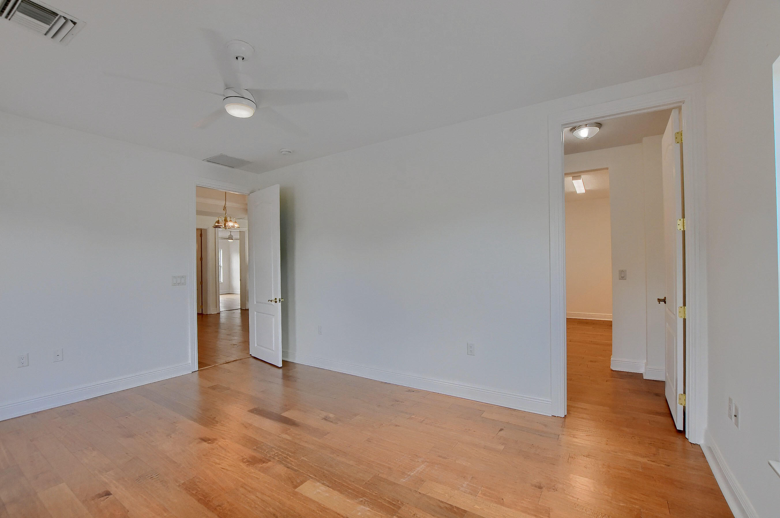9058 Southwest 4th Street Boca Raton, FL 33433 - Photo 33 of 53 a view of an empty room with glass door and a bathroom