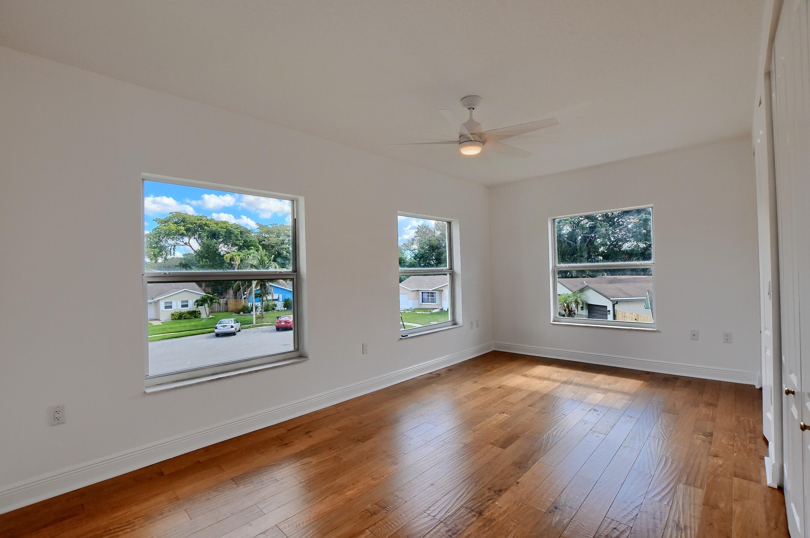 9058 Southwest 4th Street Boca Raton, FL 33433 - Photo 36 of 53 a view of livingroom with window wooden floor and window