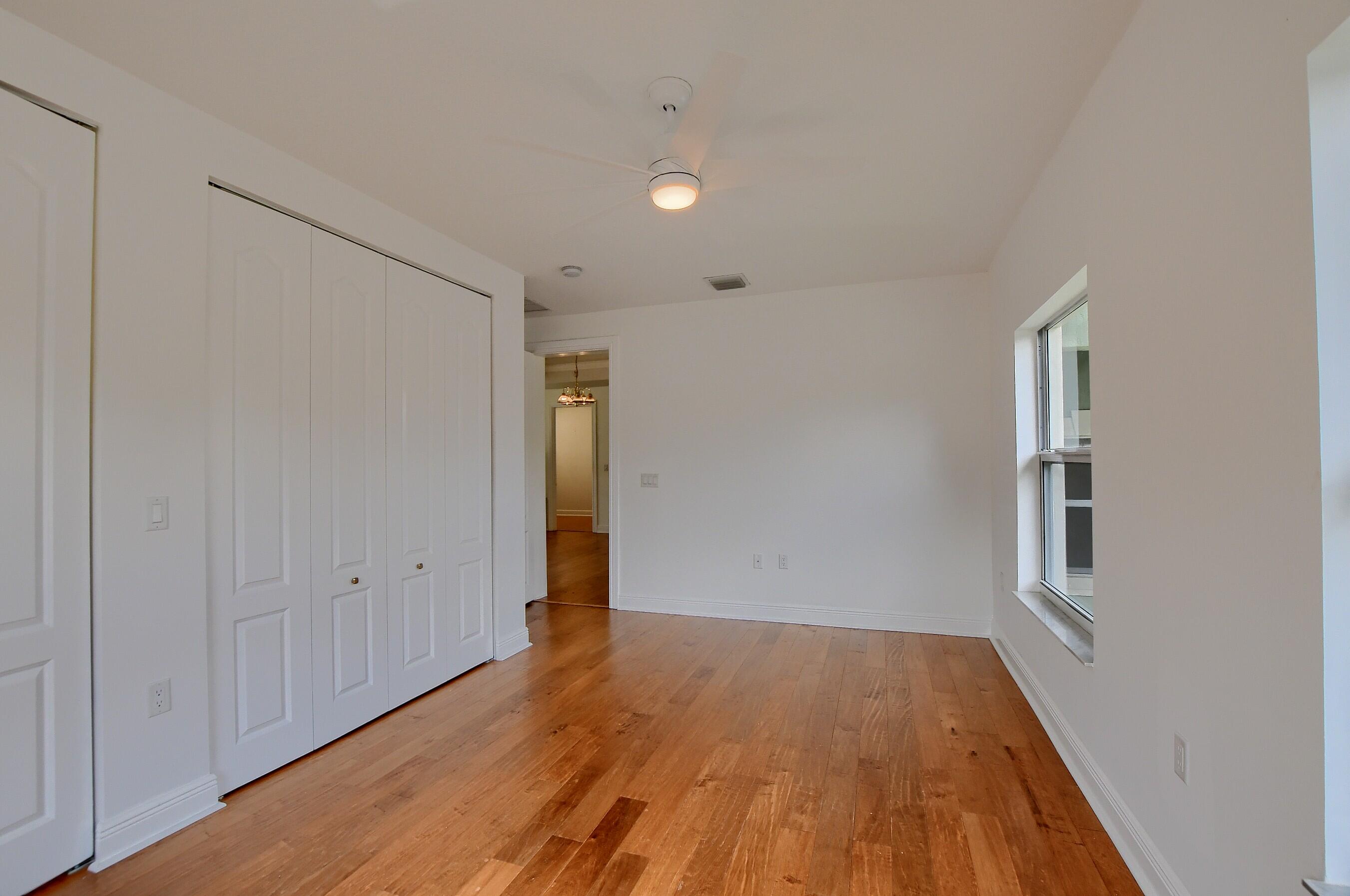 9058 Southwest 4th Street Boca Raton, FL 33433 - Photo 37 of 53 wooden floor in an empty room with a window