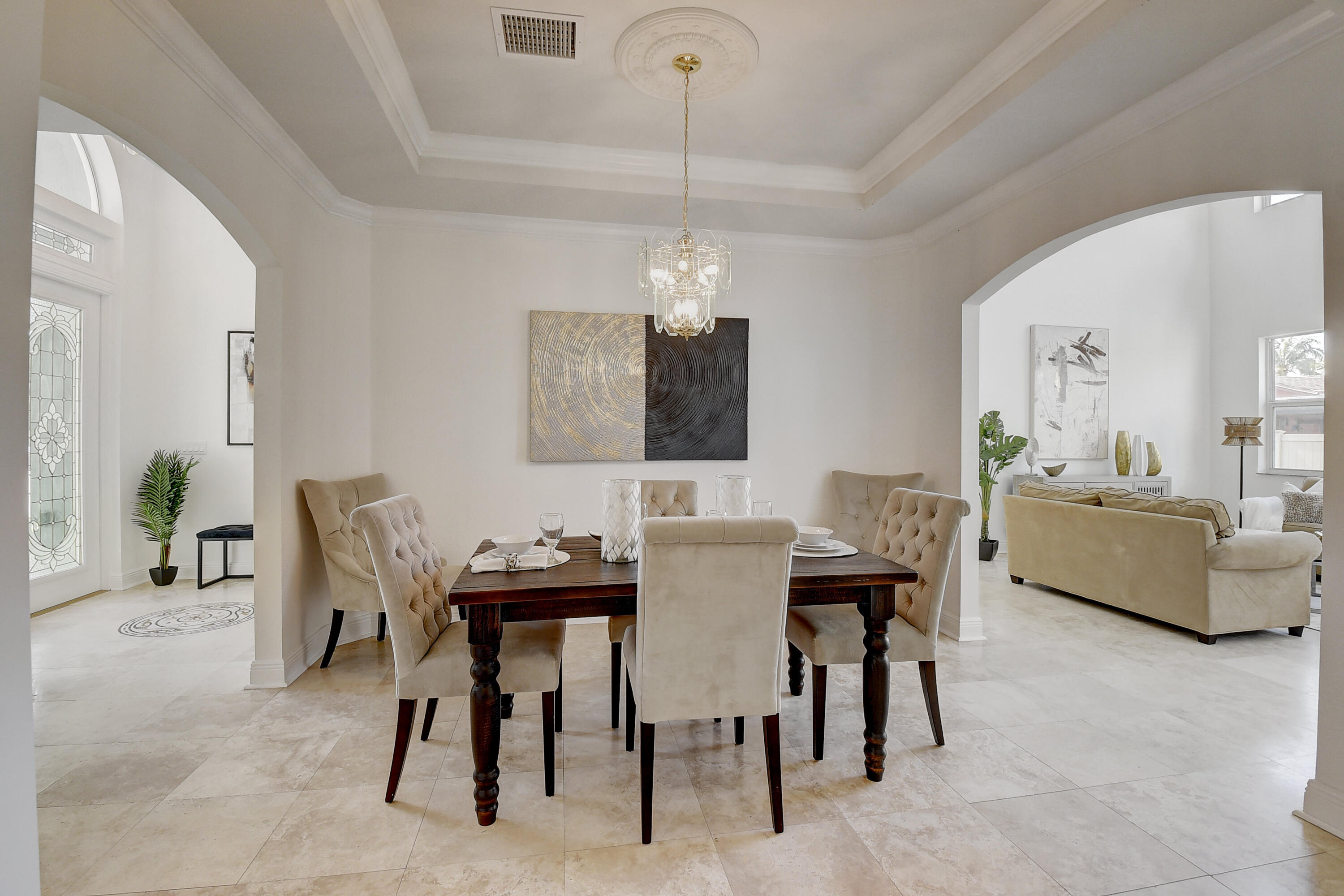 9058 Southwest 4th Street Boca Raton, FL 33433 - Photo 7 of 53 a view of a dining room with furniture and chandelier