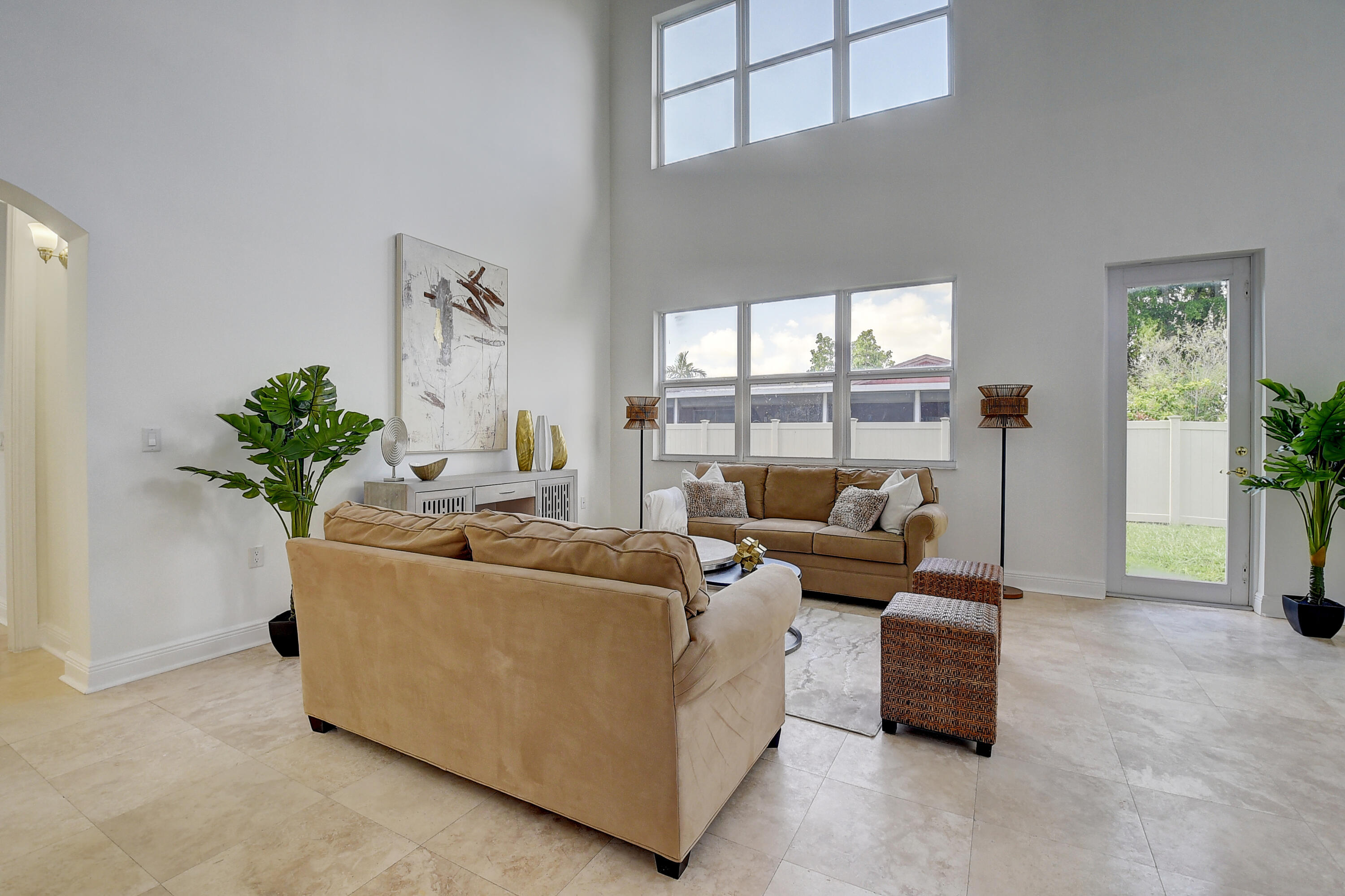 9058 Southwest 4th Street Boca Raton, FL 33433 - Photo 9 of 53 a living room with furniture and a potted plant