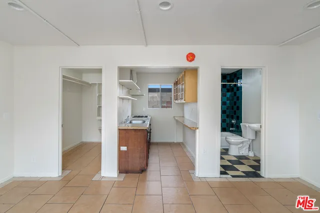 a view of an empty room with windows