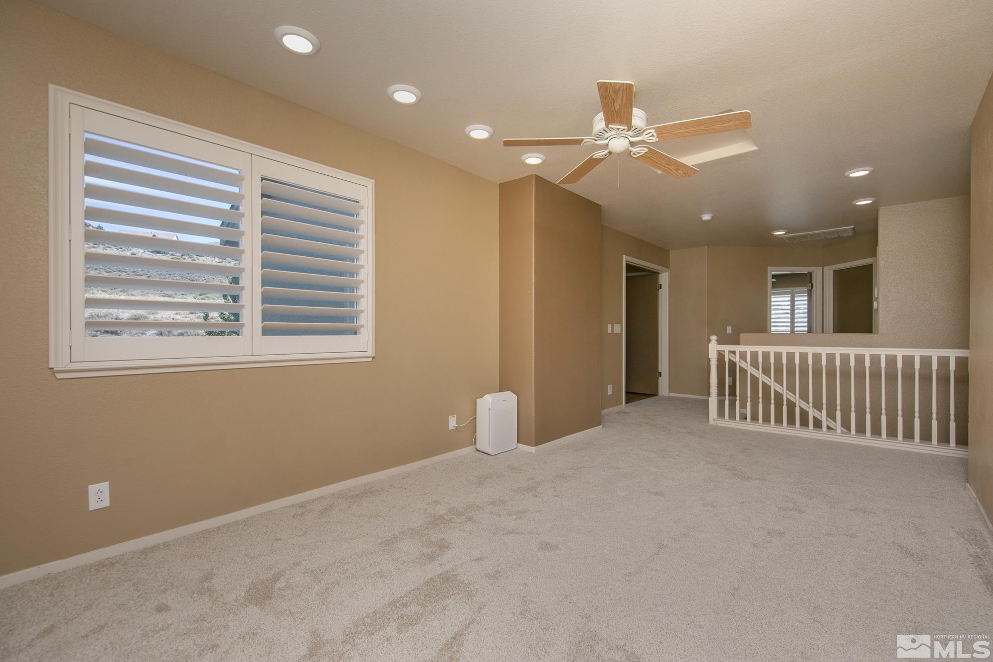 5459 Zeppelin Court Reno, NV 89523 - Photo 21 of 36 a view of an empty room with a window