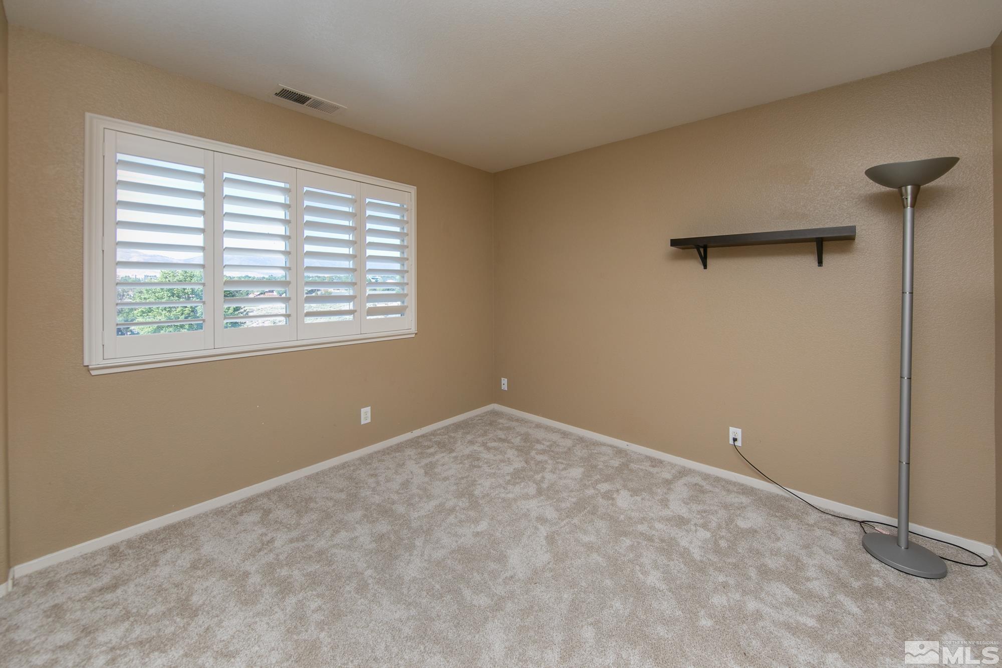 5459 Zeppelin Court Reno, NV 89523 - Photo 22 of 36 a view of an empty room with a window