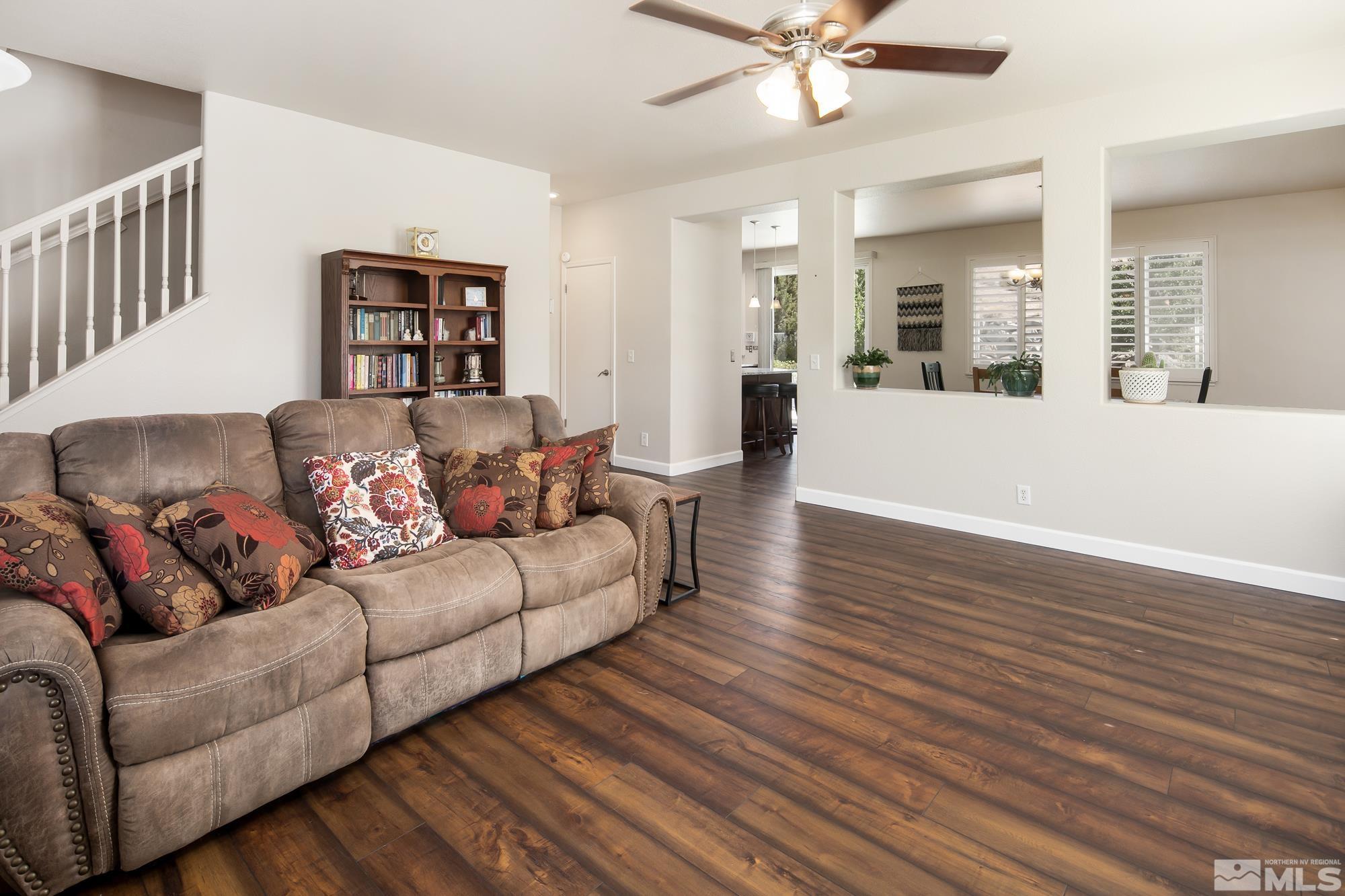 5459 Zeppelin Court Reno, NV 89523 - Photo 3 of 36 a living room with furniture and a wooden floor