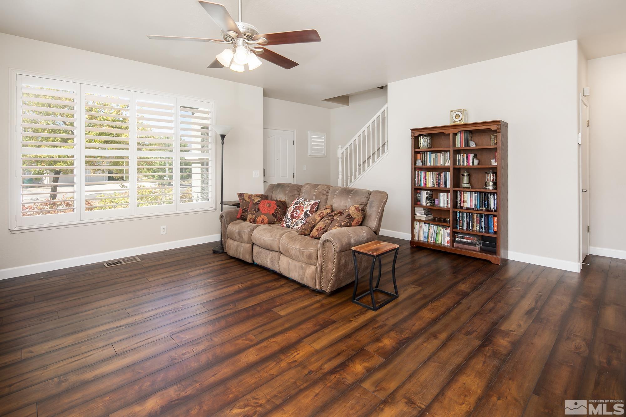 5459 Zeppelin Court Reno, NV 89523 - Photo 4 of 36 a living room with furniture and a wooden floor