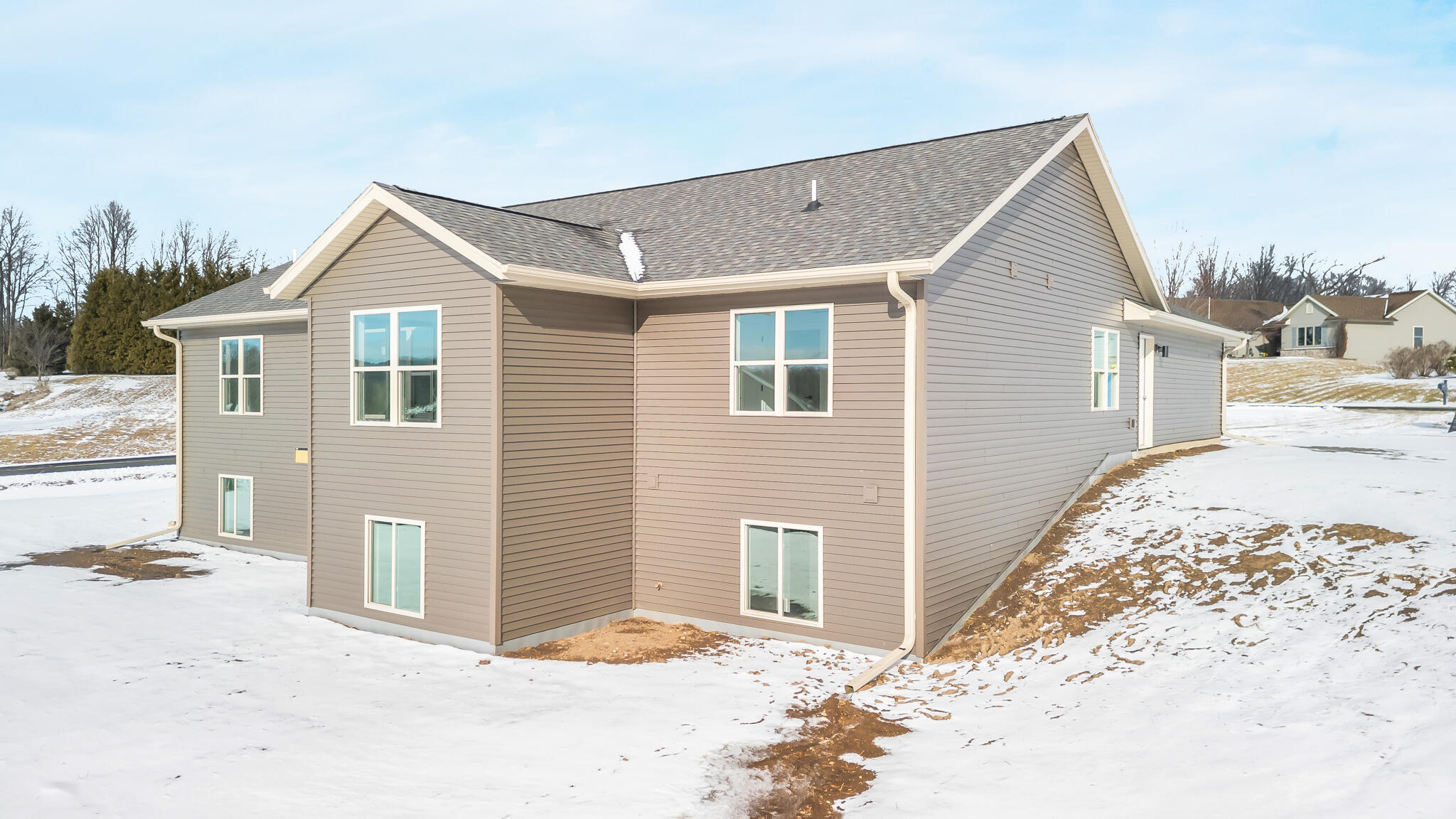 627 Bobolink Lane Cascade, WI 53011 - Photo 32 of 39 Back of House with Egress Windows
