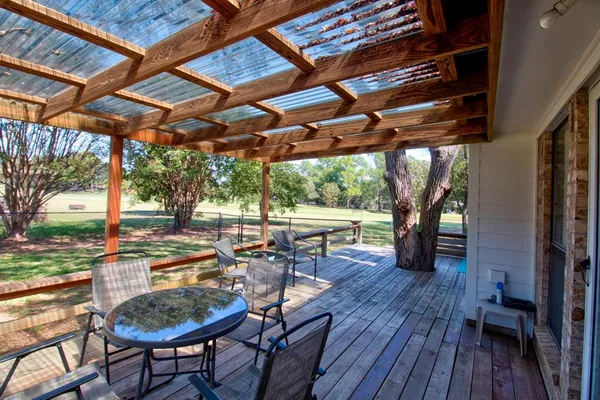 a view of a swimming pool with a patio