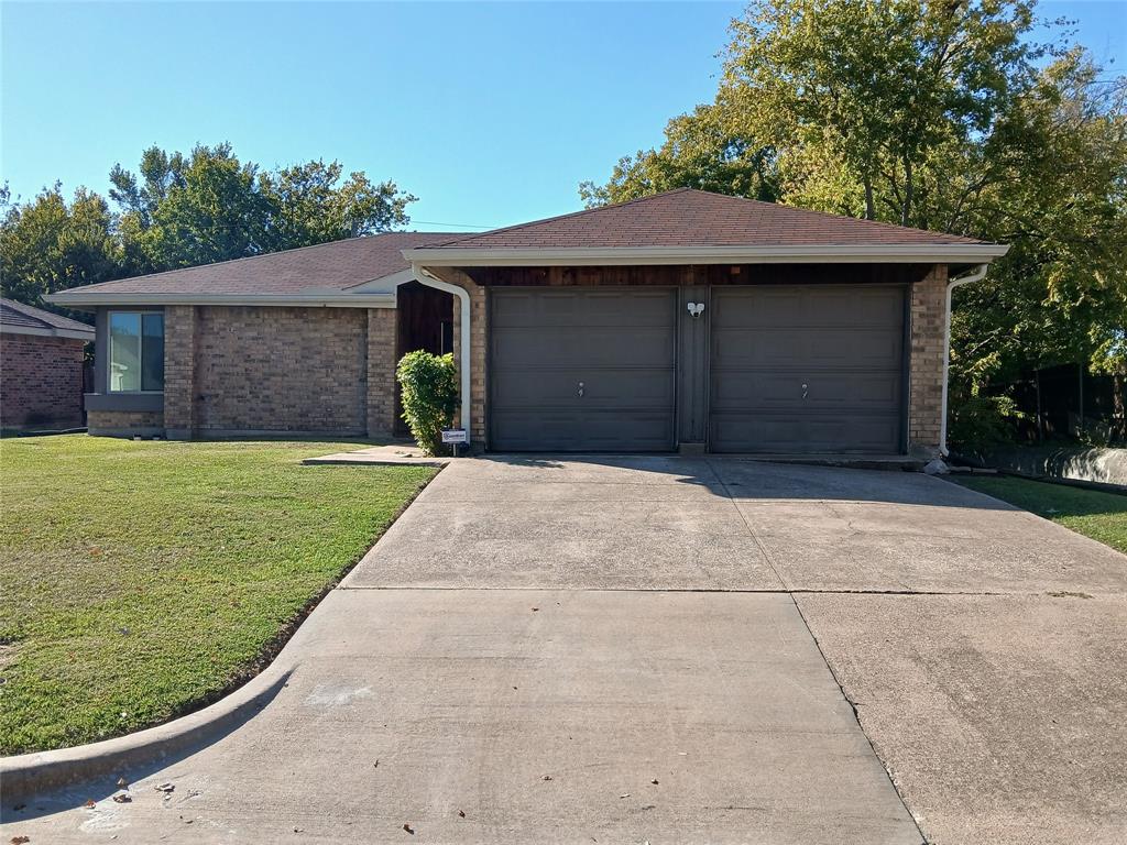 5002 South Prairieview Arlington, TX 76017 - Photo 11 of 11 a front view of a house with a yard and garage
