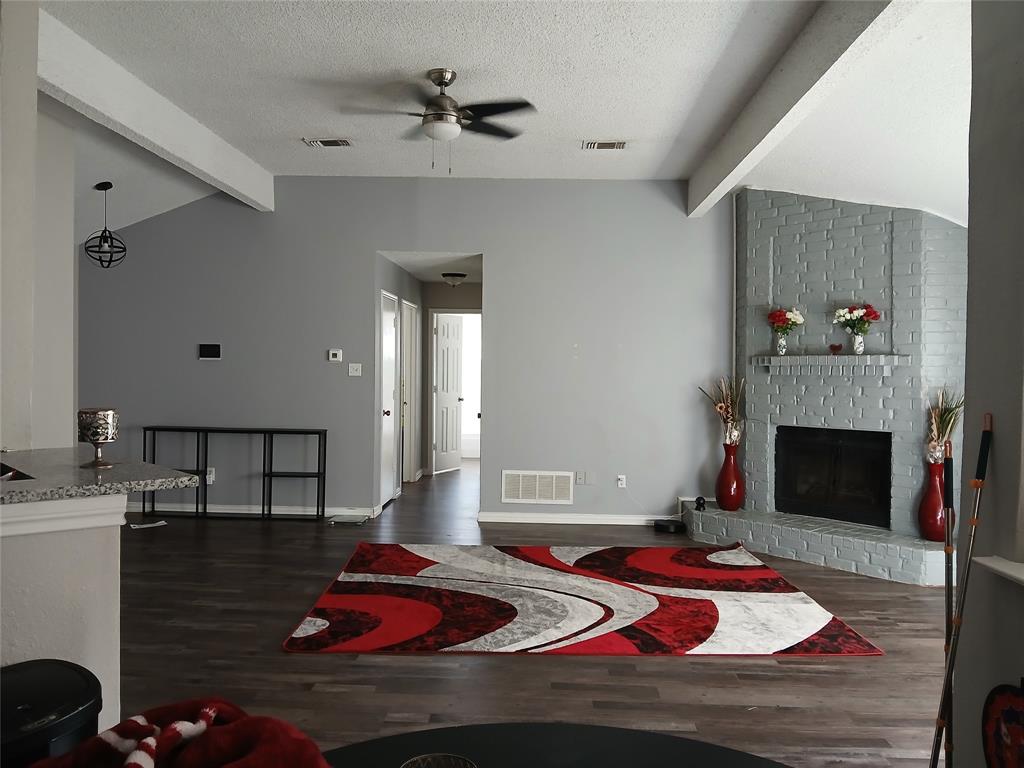 5002 South Prairieview Arlington, TX 76017 - Photo 3 of 11 a living room with furniture and a fireplace
