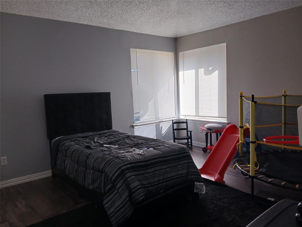 5002 South Prairieview Arlington, TX 76017 - Photo 5 of 11 a bedroom with bed and a window