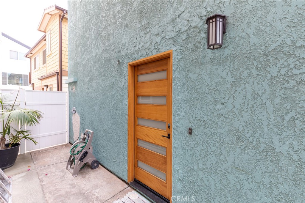 41 C Pacific Surfside, CA 90743 - Photo 4 of 20 Front door with outdoor shower to get the sand off!