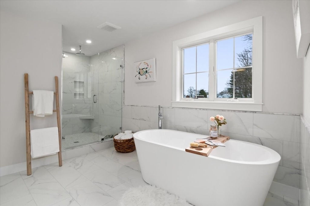 24 Jayne Road Needham, MA 02494 - Photo 18 of 34 a white bath tub sitting next to a white sink
